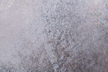gray-brown smooth background from construction plaster on a wooden base