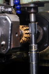 gear cutting machine close up. production of metal parts.