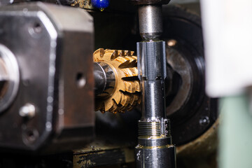 gear cutting machine close up. production of metal parts.