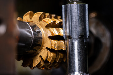 gear cutting machine close up. production of metal parts.