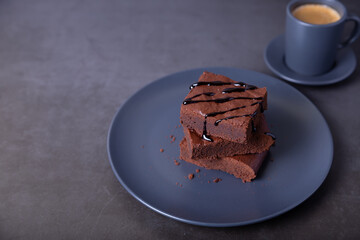 Brownie cake with Chocolate Sauce. Homemade Chocolate Dessert. A popular dark chocolate cake. Close-up, place for text.