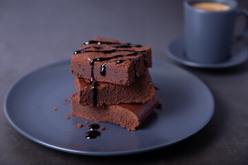 Brownie cake with Chocolate Sauce. Homemade Chocolate Dessert. A popular dark chocolate cake. Close-up.