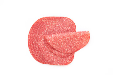 Salami slices on white background.
