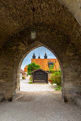 Fototapeta na wymiar Gates in Visby old town wall. Photo of medieval architecture. Gotland. Sweden