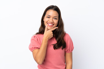 Young Colombian girl over isolated white background smiling