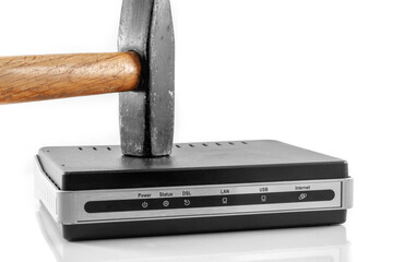 Hammer strikes the interenet modem router to break it. Day free from the Internet. On a white background close-up.