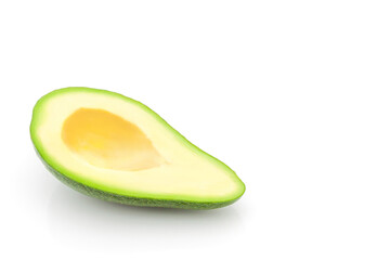 Sliced avocado half without stone close up. White background copy space. Design concept. Healthy food.
