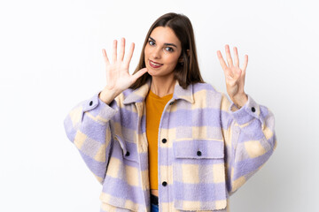 Young caucasian woman isolated on purple background counting nine with fingers