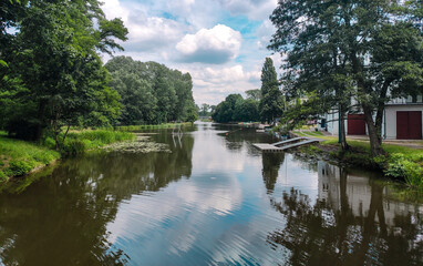 Fototapeta na wymiar Prosna river in Kalisz in summer. Poland Prosna river