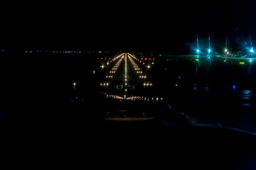 Lights on the airplane runway during the night landing of the aircraft