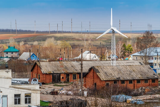 Wind turbine in the industrial area of the village. The picture was taken in Russia, in the Orenburg region, in the countryside