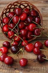 Ripe red cherries on a wooden table