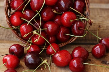 Ripe red cherries on a wooden table