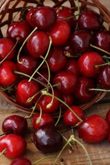 Ripe red cherries on a wooden table