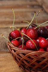 Ripe red cherries on a wooden table