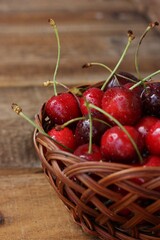 Ripe red cherries on a wooden table