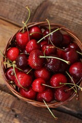 Ripe red cherries on a wooden table