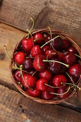 Ripe red cherries on a wooden table