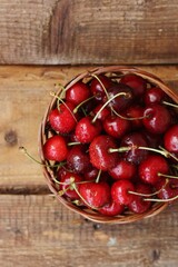 Ripe red cherries on a wooden table