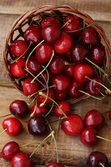 Ripe red cherries on a wooden table
