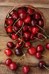 Ripe red cherries on a wooden table