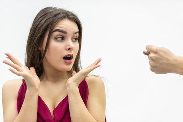 Rude man behaviour. Close up shot of girl completely shocked by her boyfriend attitude as he shows a zilch saying that she is going to get zero nothing.