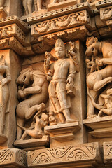 Close up of artful carved walls, Ancient reliefs at famous erotic temple in Khajuraho, Madhya Pradesh, India.