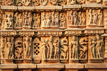Close up of artful carved walls, Ancient reliefs at famous erotic temple in Khajuraho, Madhya Pradesh, India.