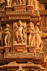 Close up of artful carved walls, Ancient reliefs at famous erotic temple in Khajuraho, Madhya Pradesh, India.