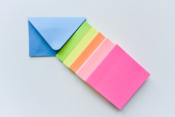 selective focus, blue envelope in the center with colored rectangles directed towards the corner