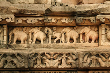 Close up of artful carved walls, Ancient reliefs at famous erotic temple in Khajuraho, Madhya Pradesh, India.