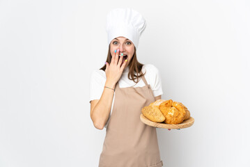 Young woman in chef uniform isolated on white background with surprise facial expression