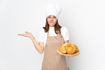 Young woman in chef uniform isolated on white background having doubts with confuse face expression