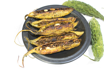 Bitter gourd filled with spices and ready for getting fried in oil
