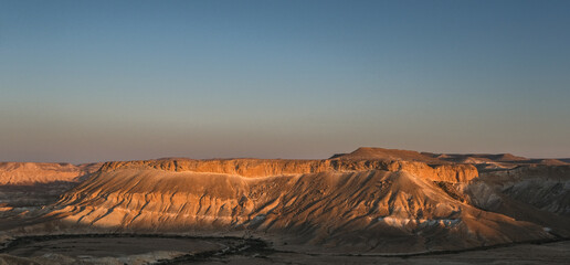 View of Nahal Zin, a 120 km long intermittent stream, the largest canyon in country, as seen at sunset from Sde Boker field school, Negev desert, Israel.\