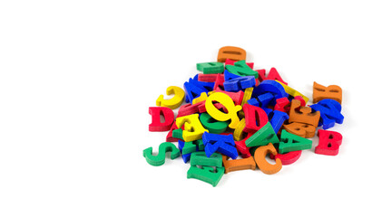 Obraz premium The head of the site or letter, template. Wooden colored letters pile on white isolated background.