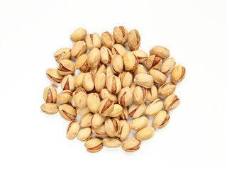 Group of raw and delicious pistachios in shell isolated on white background.