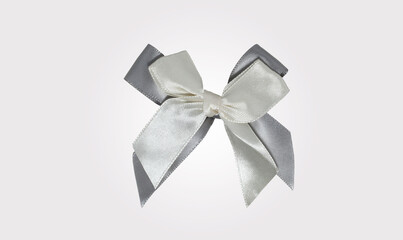 Isolated grey ribbon bow. Decoration material for holidays