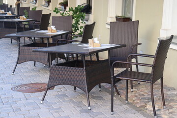 pubs street terrace with chairs and tables