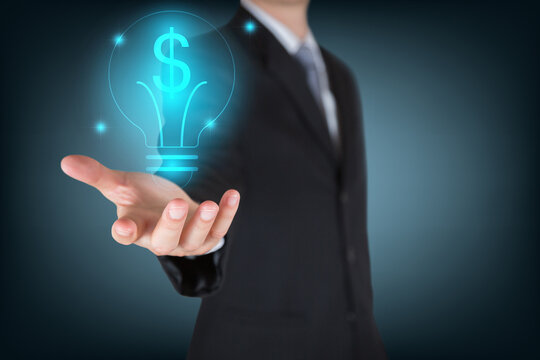 Businessman holding the glowing dollar bulb as business, innovation, intelligent, idea, income and investment concept