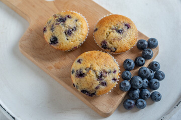 home made sweet vanilla blueberry muffins on a table