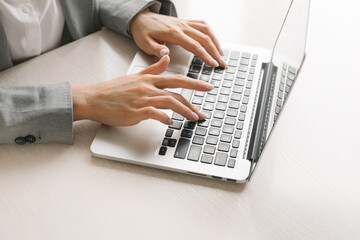Portrait of a businesswoman using laptop.