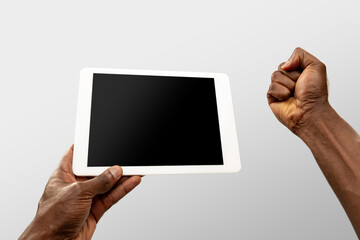Cheering, excited. Close up male hands holding smartphone with blank screen during online watching of popular sport matches, championships. Copyspace for ad. Devices, gadgets, technologies concept.