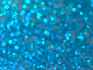 Abstract colorful blue and silver small bokeh Looks bright effect texture on black background. glitter vintage lights defocused elegant for Christmas or celebrate. Sparkling magical dust particles.