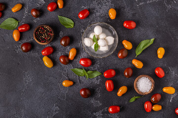 Ingredients for caprese salad: tomatoes, mozzarella and basil.