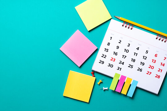 close up of calendar on the green table, planning for business meeting or travel planning concept