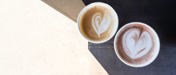 two cups of coffee cappuccino and latte art