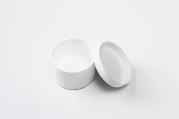 Plastic and empty white box on white background. Small,opened packaging mockup for medicine. Round design