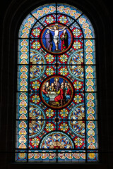 detail view of the stained glass window art inside the cathedral in Basel