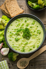 Fresh broccoli soup on the wooden table